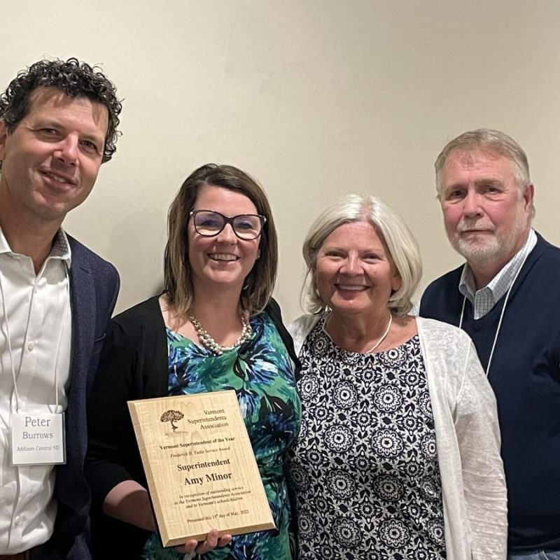 Amy Minor receiving an award with VSA staff